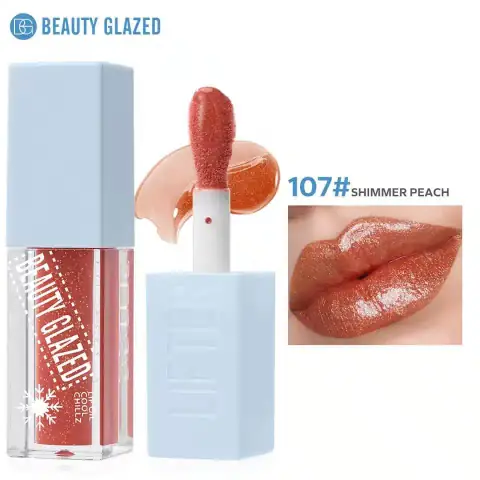 Full Beauty Glazed Lip Oil Cool Chillz 107 in shimmering peach packaging, standing upright.