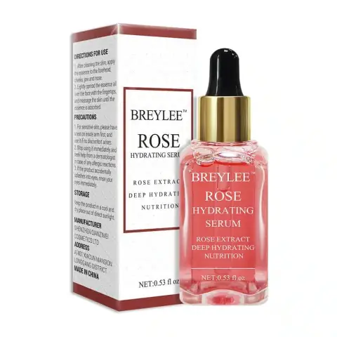 Breylee Rose Nourishing Serum in a clear glass dropper bottle with pink rose petals background.