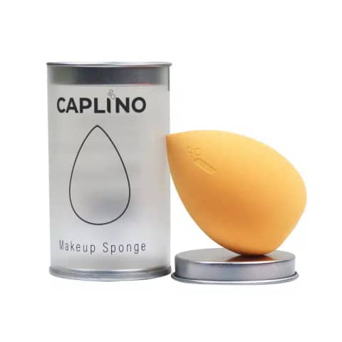 Caplino yellow teardrop makeup sponge standing upright on a clean white background, ready for blending.