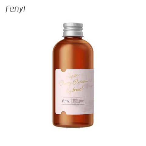 Fenyi Japan Cherry Blossom Hydrosol Toner 100ml in a transparent glass bottle with light pink liquid.