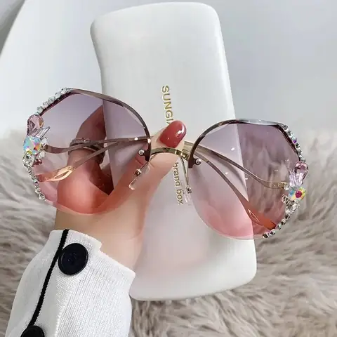 RuSu women's premium quality sunglasses, black frame with sparkling stones, viewed from top angle.
