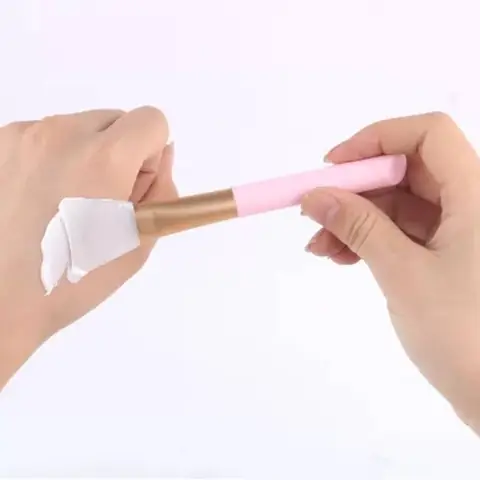 Laikou pink silicone facial mask applicator brush with clear handle, displayed on white background.