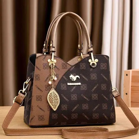 RuSu luxury big women's structured dark brown handbag with gold clasp, top handle, and shoulder strap.