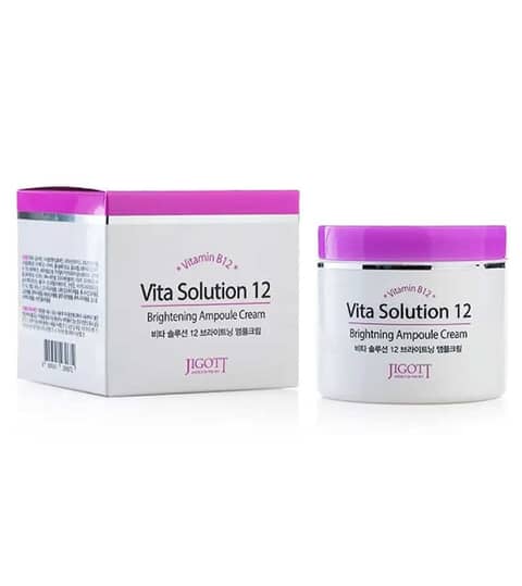Jigott Vita Solution 12 Brightening Ampoule Cream in its white jar with a golden lid.