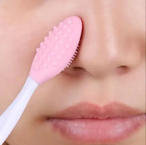 Laikou pink silicone nose brush for blackhead removal with dual cleansing ends.