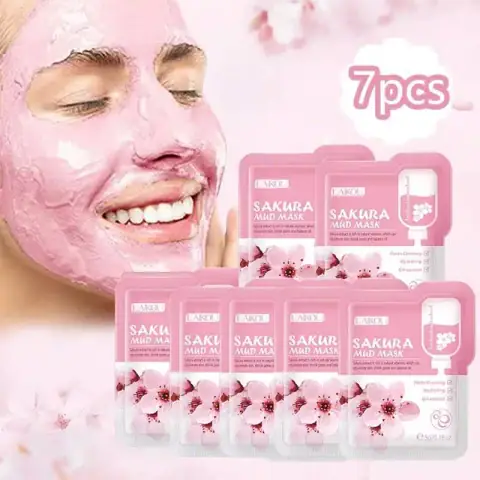 Seven Laikou Sakura Mud Mask sachets, pink and white packaging, with cherry blossom design arranged.