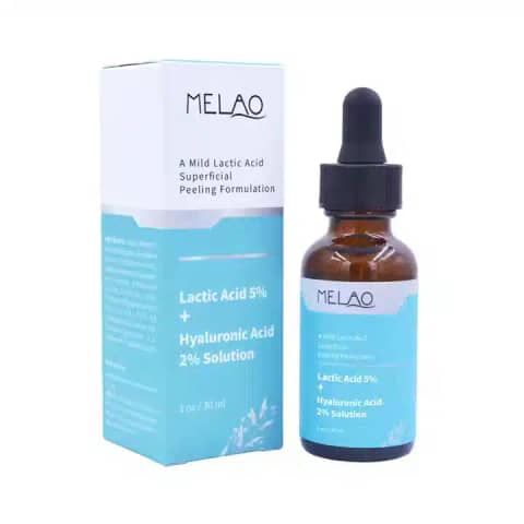 Melao Lactic Acid 5% + HA 2% serum in transparent glass bottle with dropper, beside pink box.