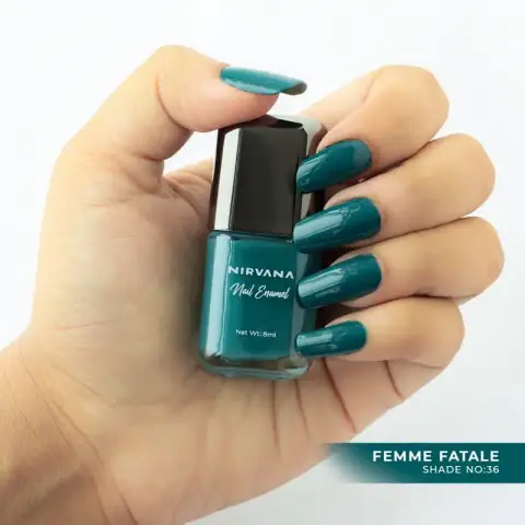 Nirvana Color Nail Enamel Femme Fatale 36 bottle, a deep red shade, standing prominently with black cap.