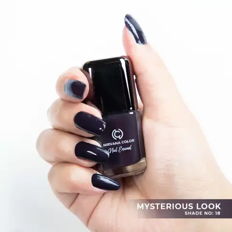 Nirvana Color Nail Enamel bottle, Mysterious Look 18, showing its dark plum shade and black cap.