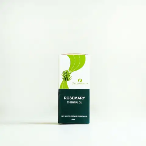 Organikaon Rosemary Essential Oil 10ml in amber glass bottle with white dropper, upright on a clear surface.