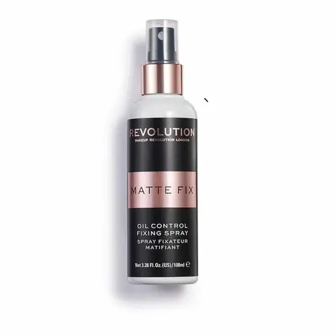 Revolution Oil Control Fixing Spray, clear 100ml bottle with white cap and black pump.
