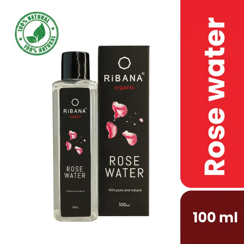 Ribana Rose Water 100ml bottle standing upright, with fresh pink rose petals scattered around.