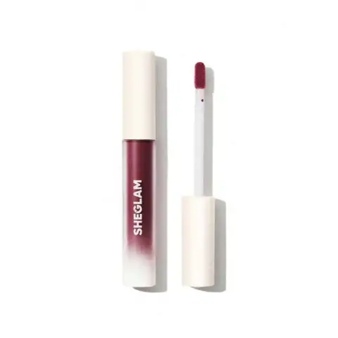 Sheglam matte liquid lipstick in City Nights, elegant black packaging with logo and applicator.