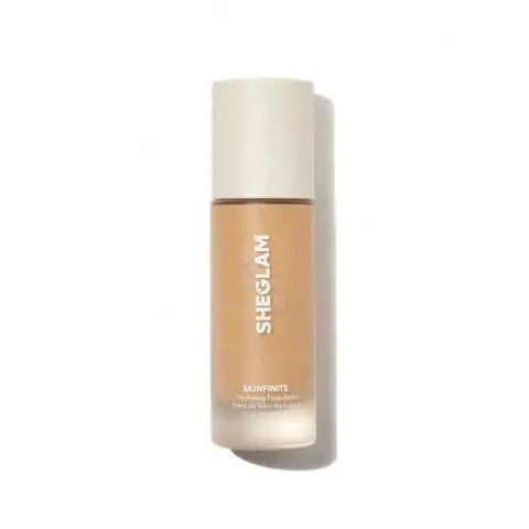 Sheglam Skinfinite Hydrating Foundation in Honey shade, clear glass bottle with elegant gold cap, front view.