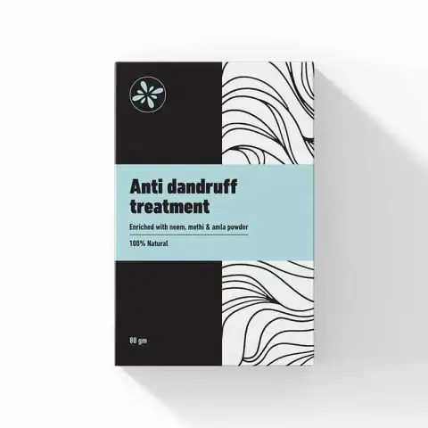 Skin Cafe Anti Dandruff Treatment hair mask in a white jar with a green lid.