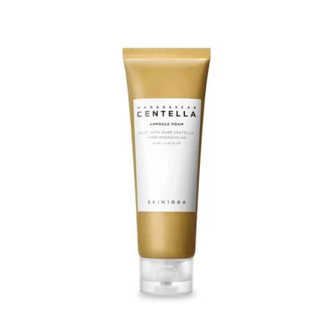 Skin1004 Madagascar Centella Ampoule Foam Cleanser tube, 125ml, front view with green plant decor.