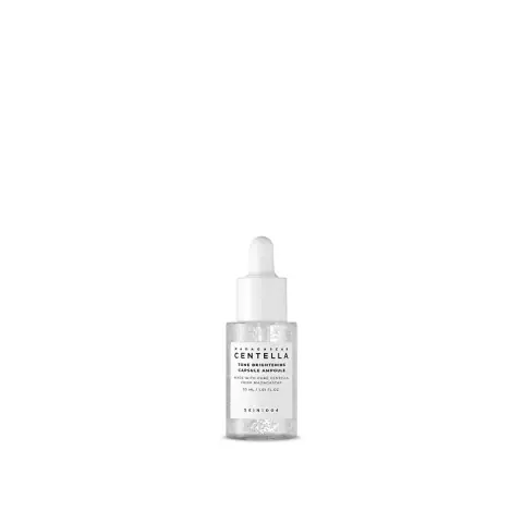 Skin1004 Madagascar Centella Tone Brightening Capsule Ampoule, clear glass bottle with white dropper, showing brightening capsules.