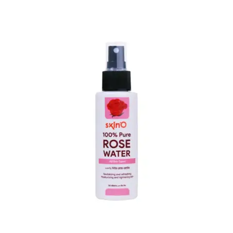 SkinO Pure Rose Water 100ml clear bottle, full, with a fresh pink rose beside it.