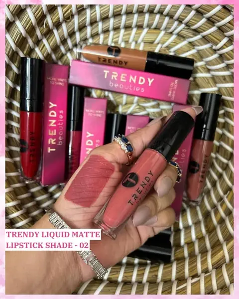 Two Trendy Beauties Liquid Matte Lipstick Waterproof 02 tubes, sleek black with elegant gold branding, on a white background.