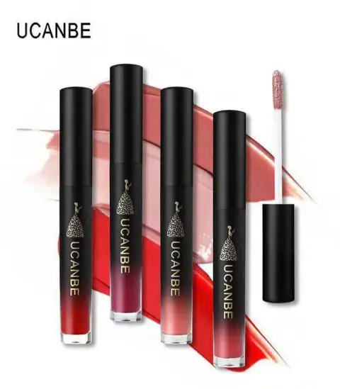 Three UCANBE Velvet liquid matte lipsticks in different shades, standing upright on a white background.